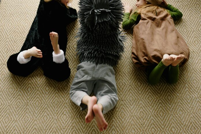 A cozy playroom with kid-friendly flooring, featuring soft, durable materials ideal for safety and easy maintenance, surrounded by toys and child-safe furniture.