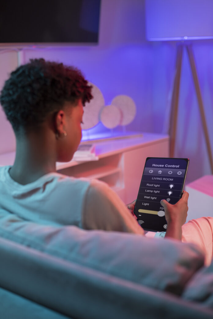Modern smart home lighting system with customizable color settings and voice control, creating a cozy and energy-efficient ambiance.