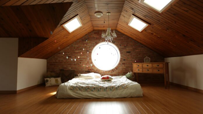 well-insulated attic with high-quality insulation material covering the floor and walls to enhance energy efficiency and temperature control.
