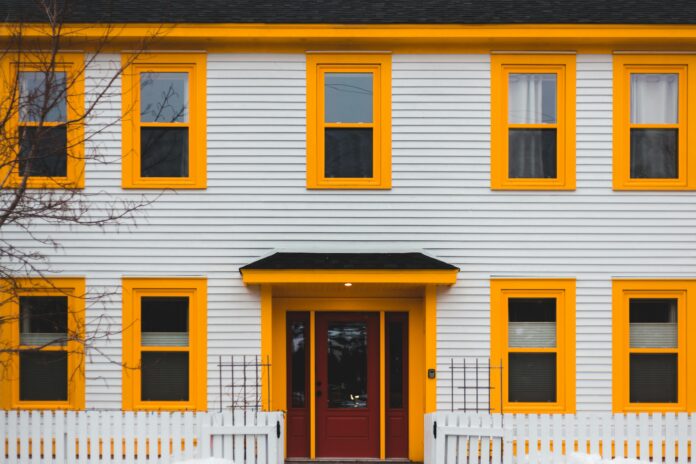 Modern home with stylish siding, showcasing enhanced curb appeal with vibrant exterior finishes