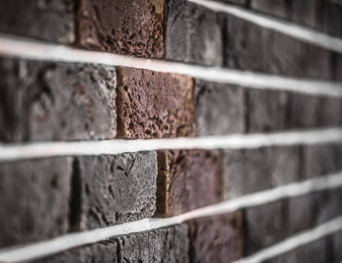 Home exterior featuring stone veneer siding for a classic and durable look.